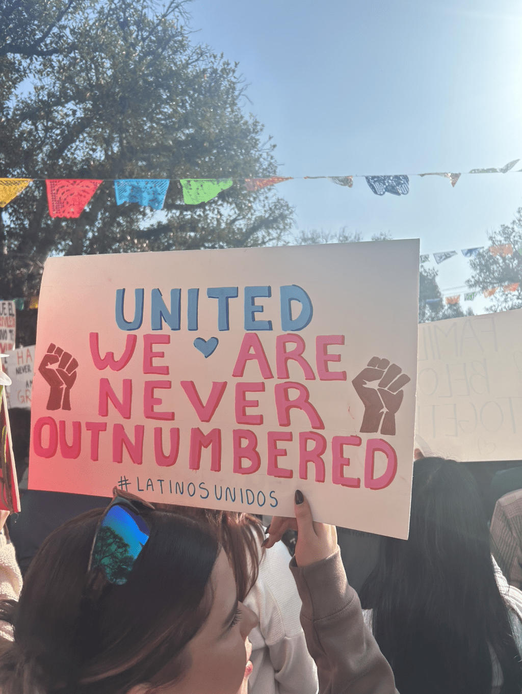 Protesters hold signs in L.A. fighting for immigration rights. Sophomore Adrianne Mercado said she knows some students who have attended the recent L.A. protests. Photo by Jade Gonzalez